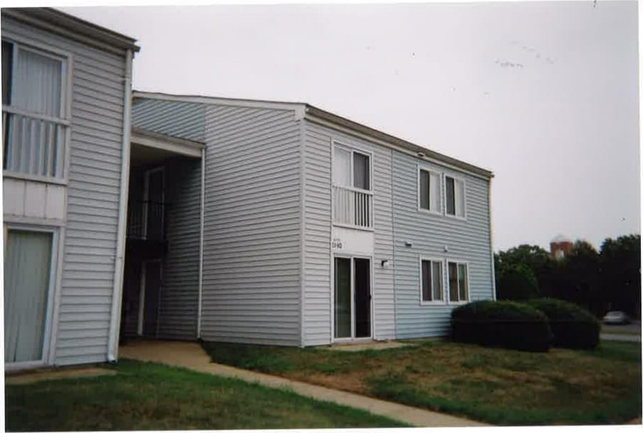 A Village Green building entrance with a covered breezeway